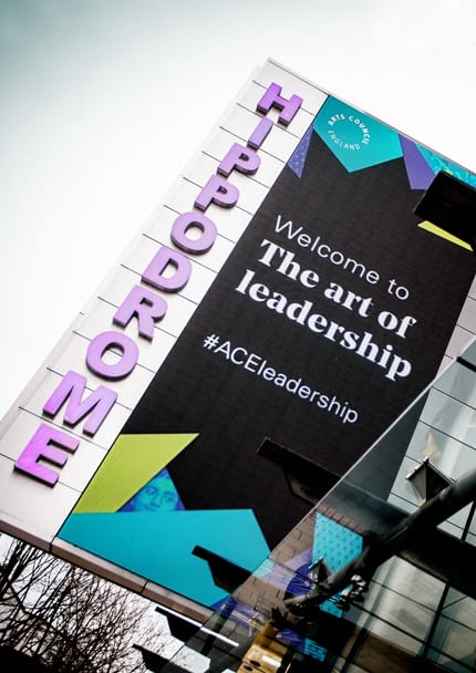 Signage outside the Hippodrome in Birmingham promoting the Arts Council England's "The art of leadership" event for their National Portfolio Organisations.