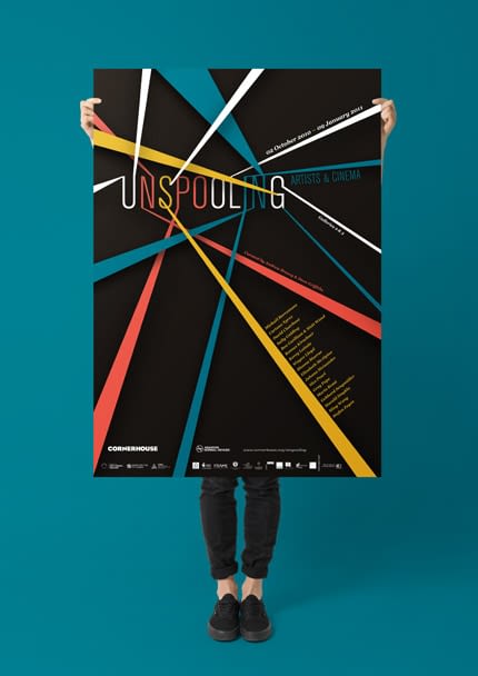 Unspooling poster for Cornerhouse: Unspooling Artist & Cinema exhibition: The word 'Unspooling' is displayed in white, red, yellow and blue letters, with strands of colour spreading out from some of the letters into the foreground as if they were jumping out of a cinema screen.