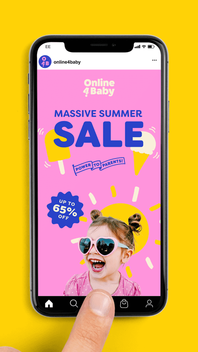An image of an iPhone displaying an Instagram Story advert from Online4Baby. The advert says 'Massive summer sale' in blue text over illustrations of an ice lolly and an ice cream on a pink background. Under the text is a flag with the strap-line 'Power to parents' on it. Below that is a cutout photo of a little girl with a big smile wearing pink heart sunglasses. Behind her is an illustration of the sun and to the left of her is a sticker that reads 'Up to 65% off'.